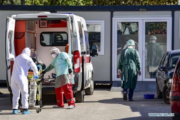 An ambulance carrying a patient infected with COVID-19 arrives at the University Clinic for Infectious Diseases in Skopje.