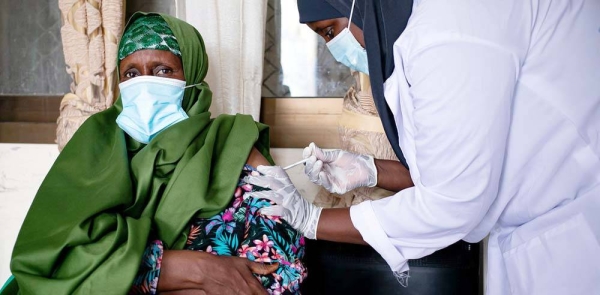A woman receives a dose of a COVID-19 vaccine at a health clinic in Garowe, Somalia. — courtesy UNICEF/Ismael Taxta