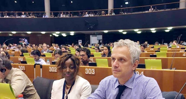 Ilias Chatzis and Yatta Dakowah, the UNODC Representative in Brussels, during a special session of the EU Parliament on migration — Brussels, Belgium — 2017. — courtesy UNODC