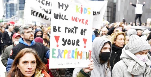 Protesters march during a demonstration against coronavirus measures in Belgium and Austria.