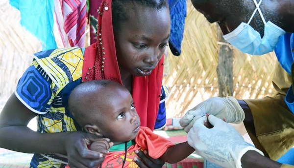 A baby is tested for malaria at a community health center in Chad. — courtesy UNICEF/Frank Dejongh