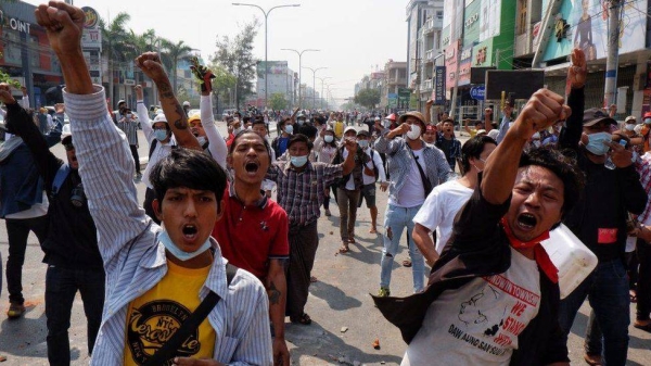 People gather to protest against the military coup in Mandalay, Myanmar on February 28, 2021.