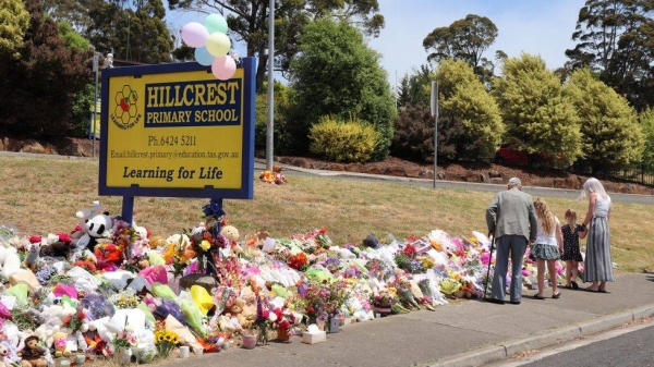 Devonport residents have left flowers, soft toys and other tributes in front of the school.
