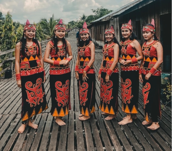 Participants showcase and honor their traditional clothes as they perform ceremonies in communal longhouses.

