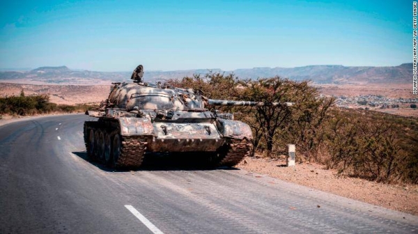 A damaged tank stands on a road north of Mekele, the capital of Ethiopia's Tigray region.
