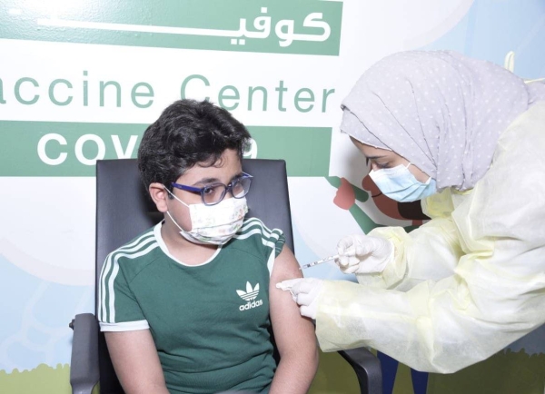 The first child in the age group of 5-11 in Saudi Arabia receives the first dose of the COVID-19 vaccine