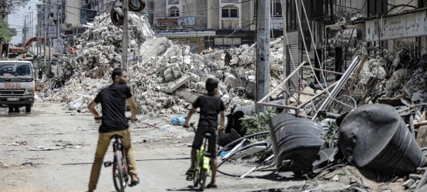 A tower block lies in ruins in Gaza city following an Israeli air strike.