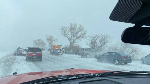 
Fire department officials deal with traffic impacted by snow in Nevada.
