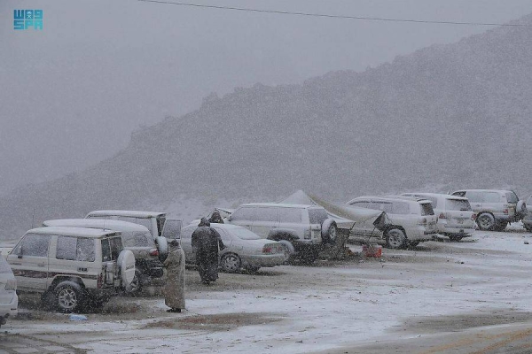 The peak of Jabal al-Lawz was completely covered in white, as the Tabuk region witnessed heavy rain and snowfall since the early morning hours on Saturday.