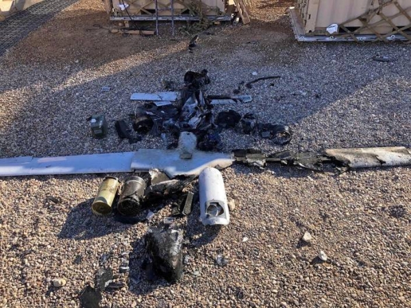 Parts of the wreckage of a drone are laid out on the ground near the Ain al-Asad airbase, in the western Anbar province of Iraq, Tuesday, Jan. 4, 2022