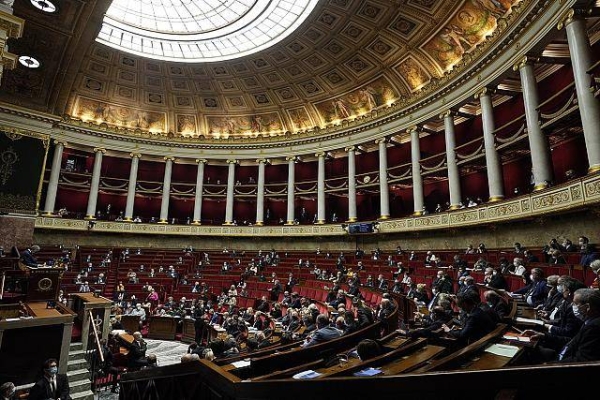 Lawmakers attend a session at the French National Assembly in Paris.