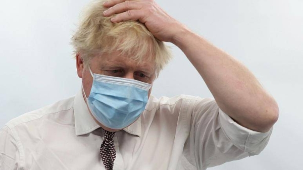Britain's Prime Minister Boris Johnson gestures during a visit to Finchley Memorial Hospital, in North London, Tuesday.