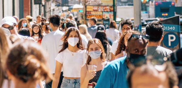 People walk on a busy street in a popular shopping district in Downtown Manhattan, New York. — courtesy Unsplash/Yoav Aziz