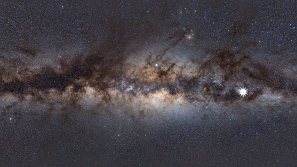 An image showing the Milky Way as viewed from Earth, with the star icon showing the position of the mysterious repeating transient.