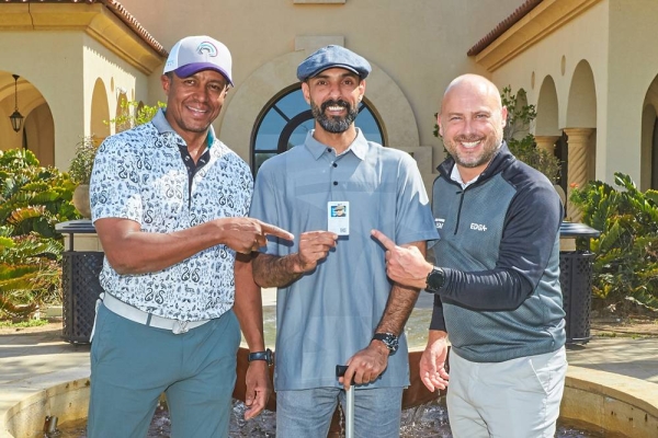 Amer Al Rumaih (center) poses with his EDGA membership card.