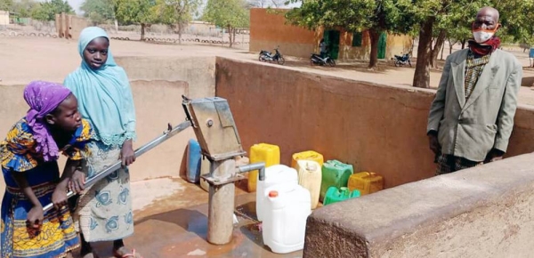 Lambda stands in his compound in the commune of Tougouri, northern Burkina Faso. — courtesy UNHCR/Barry YN Maxime