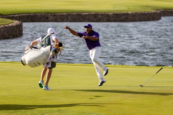 Varner celebrates his mammoth winning putt dropping