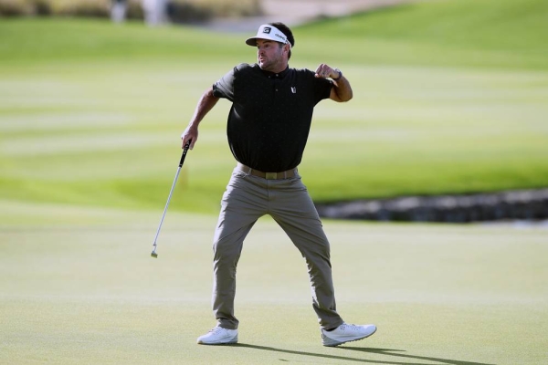 Varner celebrates his mammoth winning putt dropping