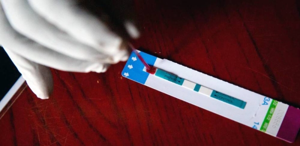 A nurse performs a HIV test at a hospital in Wau, South Sudan. — courtesy UNICEF/Albert Gonzalez Farran