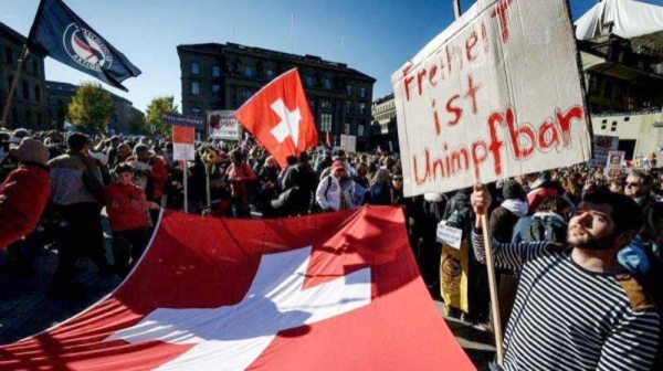 Anti-vaccination protesters have taken to the streets of Bern ahead of the vote.