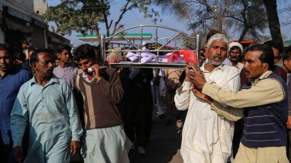 Relatives and locals carry a coffin containing the body of a man for his funeral in Khanewal on Sunday.