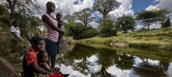 Local women gather at a river in Mucheni, Zimbabwe.