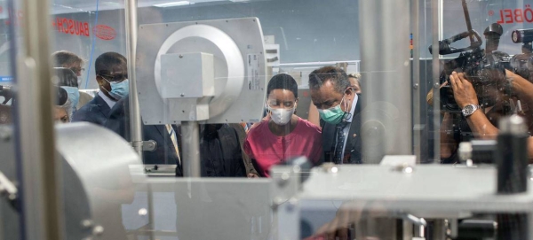 WHO Director Tedros Ghebreyesus (right) and Belgian Development Minister Meryame Kitir visit Biovac, a WHO Vaccine Hub in Cape Town, South Africa.