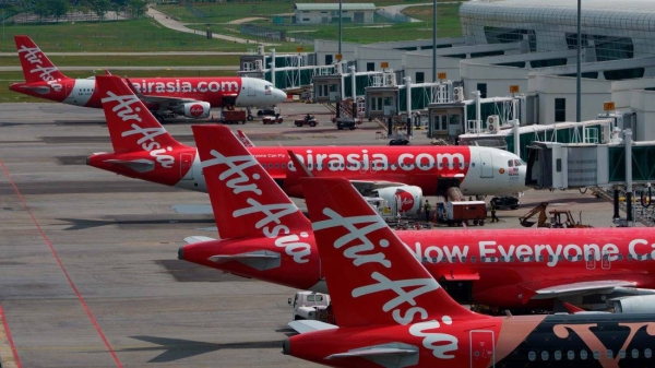 AirAsia Airbus planes sit on the tarmac at a terminal in Sepang, Malaysia.