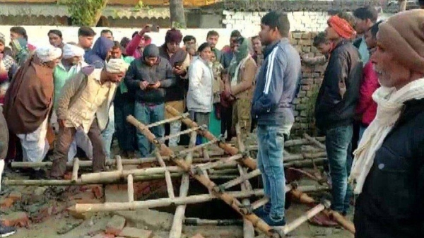 The guests were sitting on a metal slab covering the well.