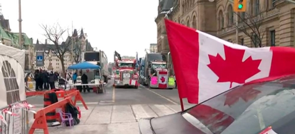 Police arrested scores of demonstrators and towed away vehicles Friday in Canada's besieged capital, and a stream of trucks started leaving under the pressure, raising authorities' hopes for an end to the three-week protest against the country's COVID-19 restrictions.