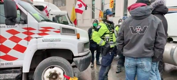 Police arrested scores of demonstrators and towed away vehicles Friday in Canada's besieged capital, and a stream of trucks started leaving under the pressure, raising authorities' hopes for an end to the three-week protest against the country's COVID-19 restrictions.