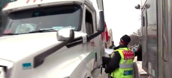 Police arrested scores of demonstrators and towed away vehicles Friday in Canada's besieged capital, and a stream of trucks started leaving under the pressure, raising authorities' hopes for an end to the three-week protest against the country's COVID-19 restrictions.