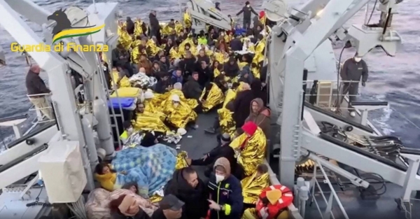 The young man of 21, center, who said he comes from Belarus was located at the stern of the Euroferry Olympia in apparently good condition. He was reported missing on the Italian ferry on fire off the Greek island of Corfu has been found alive and rescued.