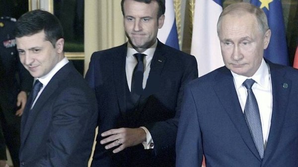 French President Emmanuel Macron (C), Russian President Vladimir Putin (R) and Ukrainian President Volodymyr Zelenskyy (L), in Paris, France, in this file photo.