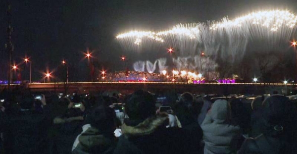 Fireworks explode during the closing ceremony of the 2022 Winter Olympics, Sunday, in Beijing.