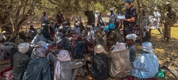 A joint team of United Nations police, Central African defense and security forces, and MINUSCA, interact with the population of Kidjidji, to assess the security situation, in Central African Republic