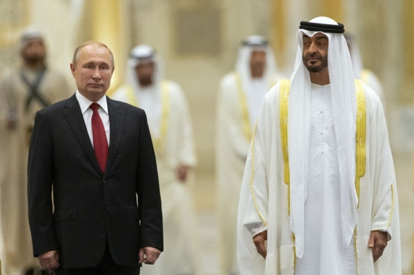 FILE: Russian President Vladimir Putin, left, and Abu Dhabi Crown Prince Mohamed bin Zayed al-Nahyan attend the official welcome ceremony in Abu Dhabi, United Arab Emirates, Oct. 15, 2019. 