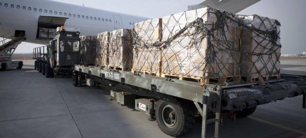 A cargo of high energy biscuits for Ukrainian refugees is offloaded at an airport in Poland. — courtesy WFP/Marco Frattini