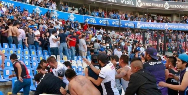 Fighting in the stands at La Corregidora stadium.