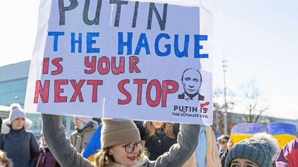 Demonstrators protest Russia's massive military operation against Ukraine during a rally on the place of the United Nations in Geneva, Switzerland, Feb. 26, 2022. — courtesy Salvatore Di Nolfi/Keystone via AP