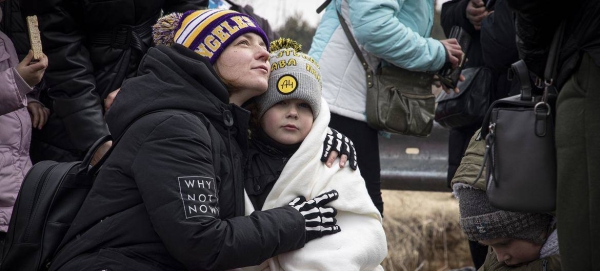Thousands of Ukrainians seek safety in neighboring Poland.