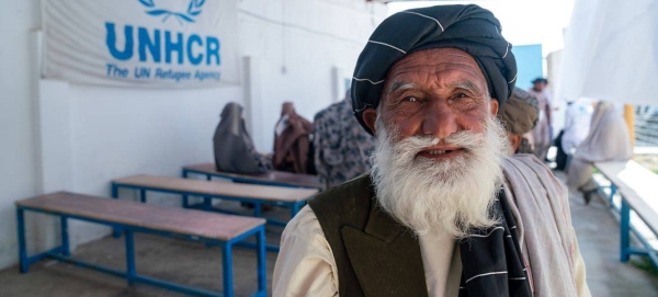 An internally displaced person waiting for his turn to receive financial aid from UNHCR, in Afghanistan.