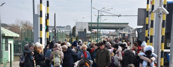 Refugees entering Poland from Ukraine at the Medyka border crossing point.
