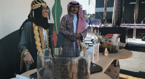 Young Saudi men and women in the Saudi Coffee booth in Saudi cultural costumes from all regions of the Kingdom who draw, through their welcome and smiles, all the guests to visit the booth.