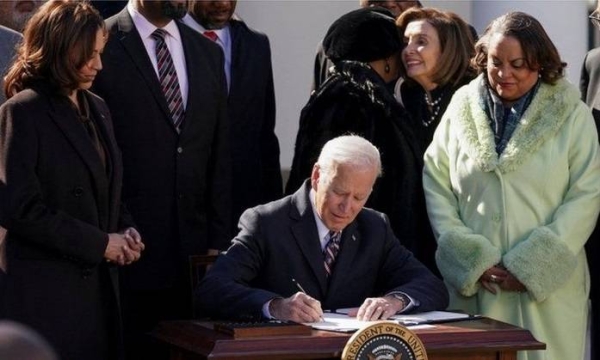 President Joe Biden signs into law the Emmett Till Antilynching Act.