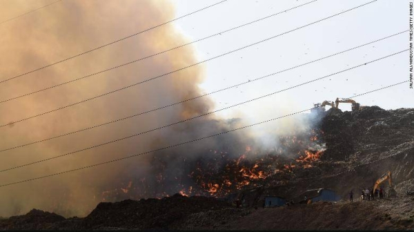 Firefighters battle the blaze at the Ghazipur landfill on March 28, 2022 in New Delhi, India