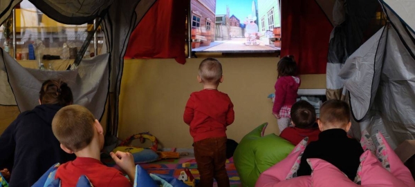 On 9 March 2022 in Medyka, southeast Poland, children play in the corner of a school gymnasium set up to host refugee families who have fled the war in Ukraine.