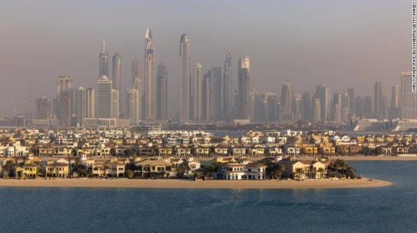 A view of the villas on the waterside of the Palm Jumeirah, backdropped by skyscrapers beyond, in Dubai, United Arab Emirates, in February 2022.