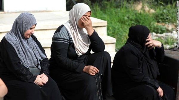 Relatives mourn during the funeral of Ghada Sbatin, who died after being shot by Israeli soldiers, in the West Bank village of Husan, on April 10.