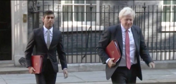 British Prime Minister Boris Johnson and Chancellor of the Exchequer Rishi Sunak seen leaving No. 10 Downing Street.